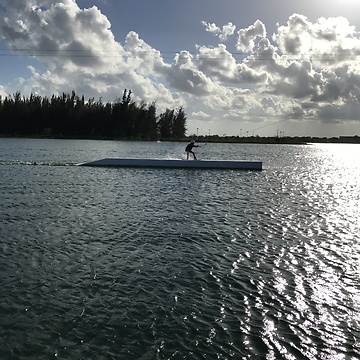 Girl Wakeboard into sunset