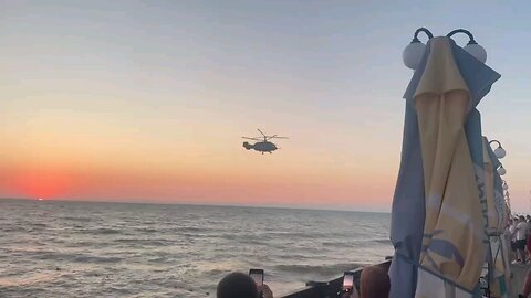 Sunset aerobatics of a Kamov Ka-29 of the Naval Aviation of the Black Sea Fleet over Crimea.