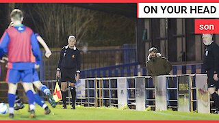 David Beckham spotted standing alone in a shabby stand at a football ground