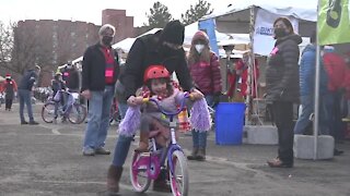 Children receive new bikes at the Boise Bicycle Project holiday giveaway