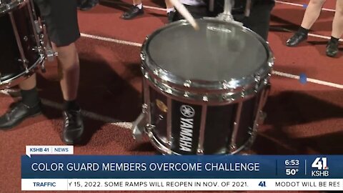 Color guard members overcome challenge