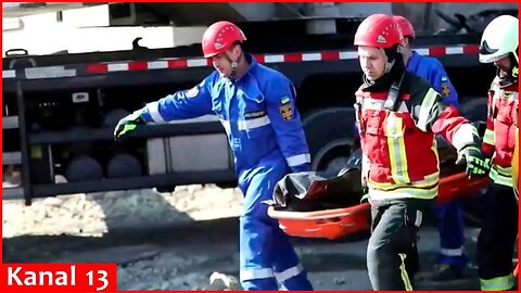 Emergency workers carry out body from attack site near Kyiv - police video