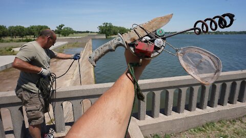 MAGNET FISHING A HUGE DAM I CAN'T BELIEVE WE FOUND THIS!!