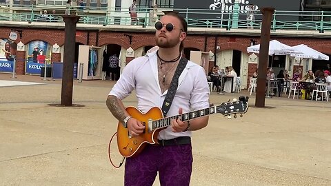 I was passing by and heard exceptional guitar sounds! Musician Jacob Addison beach busking.