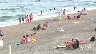 People enjoying the beach and Labor Day together