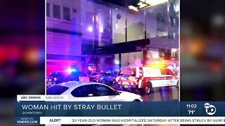 Woman hit by stray bullet in downtown