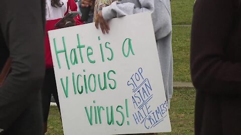 Community members rally calling for an end to Asian American violence