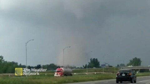 Tornado forms and spins beside Quebec highway