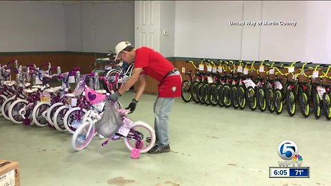 Firefighters and paramedics assemble bikes for kids in Martin County