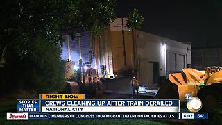 Crews work to clean up mess after train derailment