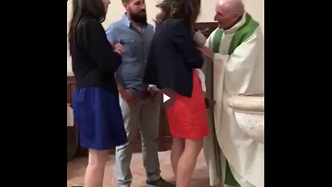 Priest hits crying baby during baptism.