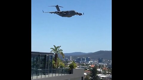 Military Cargo Plane Flies Insanely Close To The City Of Brisbane, Australia