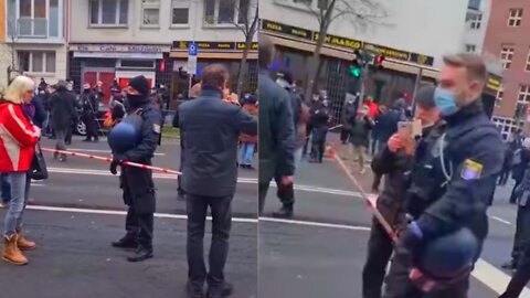 German Police Use Social Distancing Sticks To Keep People Apart