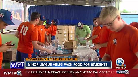 Minor league helps pack food for students