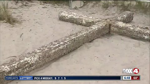 Barnacle-covered wooden cross washes up on Florida beach