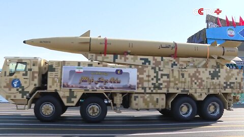 Iran unveils homegrown long-range ballistic missile and kamikaze-drone at military parade