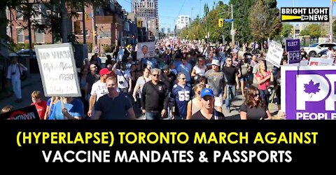 (HYPERLAPSE) TORONTO PROTESTERS MARCH AGAINST VACCINE MANDATES & PASSPORTS