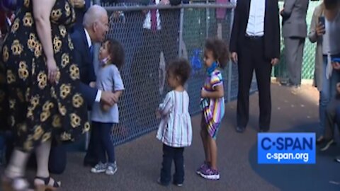 Biden hugs maskless children with no mask himself while protesters calling out Biden