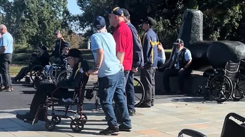 Honor flight veterans stop to watch Airman get his Colonel pin