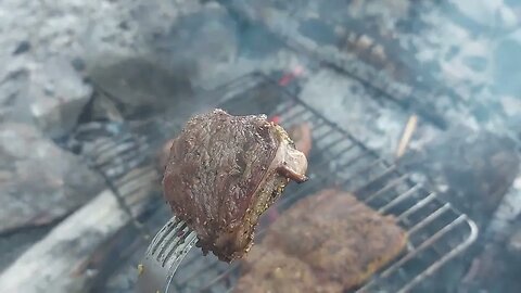 Cooking up steaks at the camp.