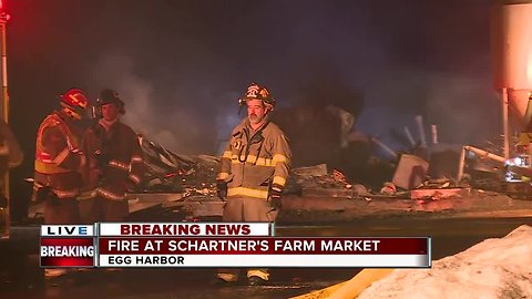 Crews battle fire at Schartner Farm Market