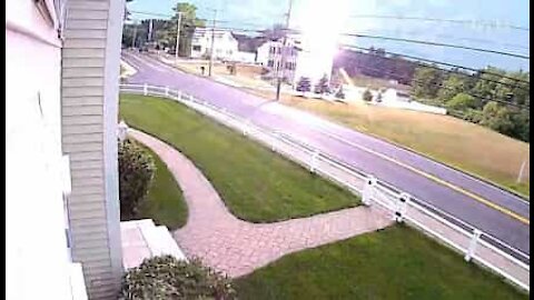 Security camera records moment lightning strike hits home