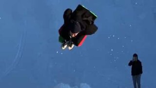 Young man pulls off backflip on sleigh!