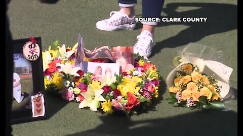 Heart shaped wreath placed in front of Welcome to Las Vegas sign to honor COVID-19 victims