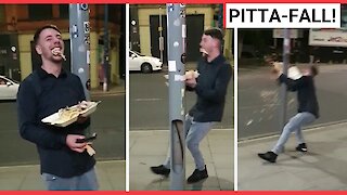 Drunk man drops kebab after leaning on lamppost