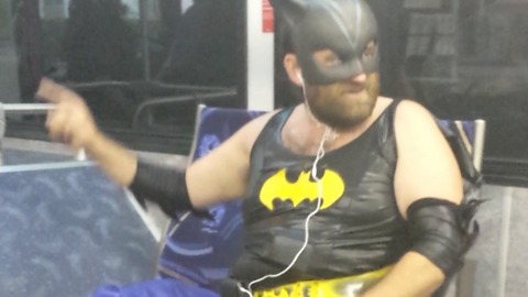 A Guy Dressed As Batgirl Sings A Pop Song