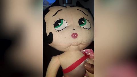 A Young Boy Gets Scared By A Betty Boop Doll