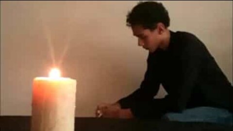 Kid extinguishes candle by throwing cards