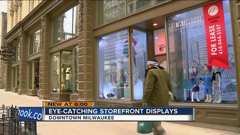 Downtown businesses decorate empty store fronts