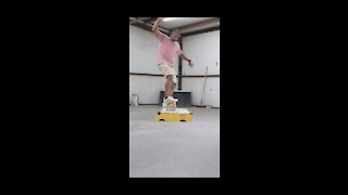 45 year old skateboarder practicing board slides