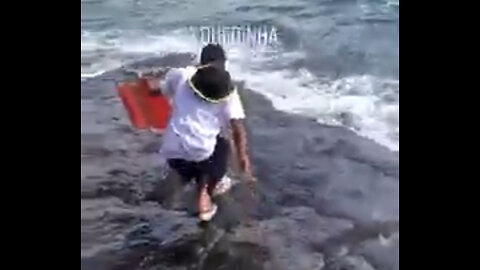 Guy Slips on Wet Rocks Fail! 🤣🤣