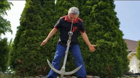 Bizarre: Man puts hook in nose and swings anchor!