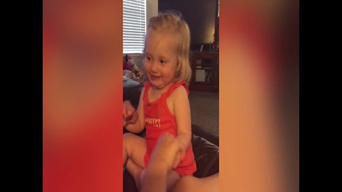 Laughing Little Girl shows off her Serious Side