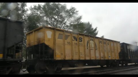 Empty Coal hoppers in the rain w/ pier 6