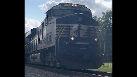 NS Locomotive hauling shipping containers