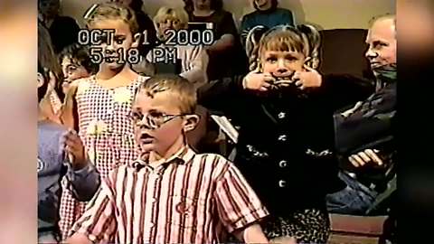 Young Girl In Choir Makes Crazy Faces