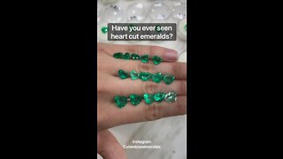 Loose Colombian emeralds heart shape on hand with price and certified