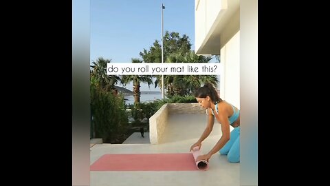 rolling up a yoga mat