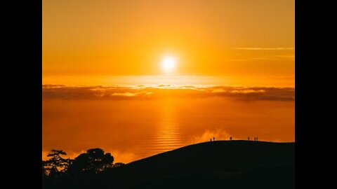 stunning sunrise in a foggy morning