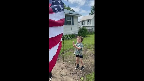 Owen Helps with American Flag