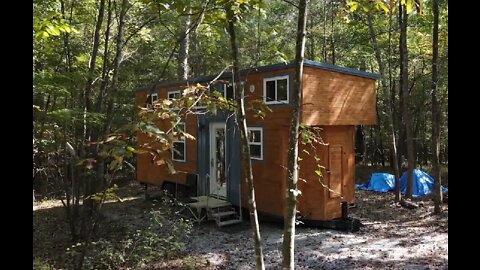 Modern Tiny House nestled in the woods, with double loft and art studio