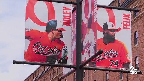 Locally-made Orioles flags fly at Camden Yards