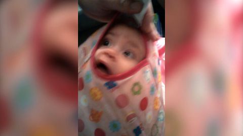 Baby Discovers New Way To Play Peekaboo