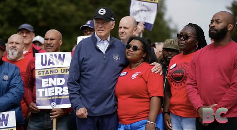 Biden makes history by joining striking US car workers