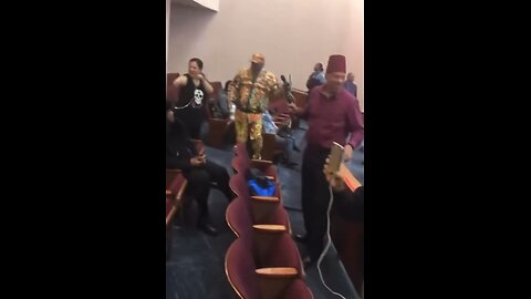 Citizens at a Chicago City Council meeting chant “Go Red, No More Blue, No Matter Who”