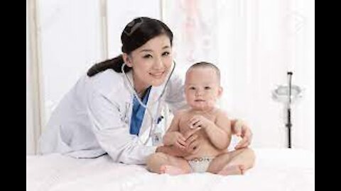 Laughing baby in the pediatricians clinic